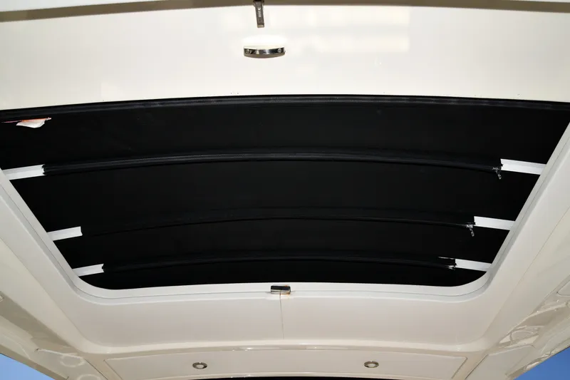Slide: The Image of 2017 Sea Ray SLX 310 boat retractable sunroof interior view. - 42