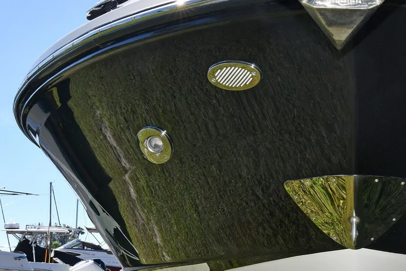 Slide: The Image of 2017 Sea Ray SLX 310 boat hull with chrome details and sleek design. - 15