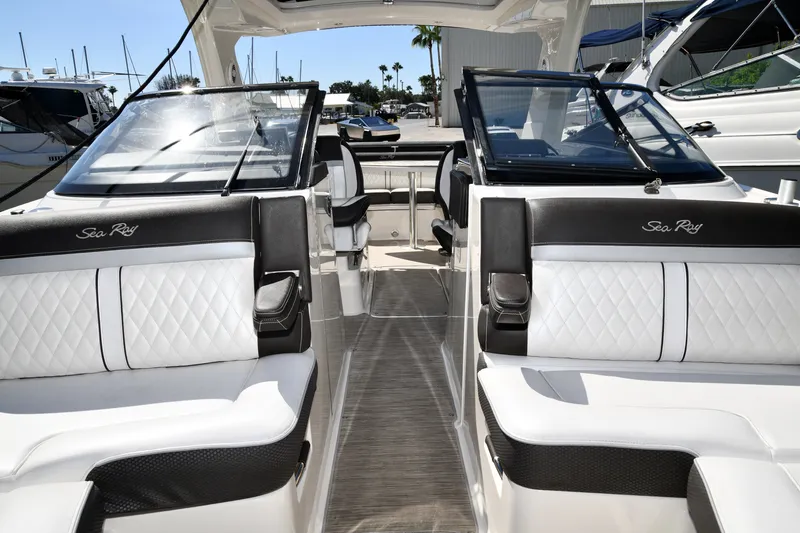 Slide: The Image of 2017 Sea Ray SLX 310 boat interior with luxurious seating and sleek design. - 22