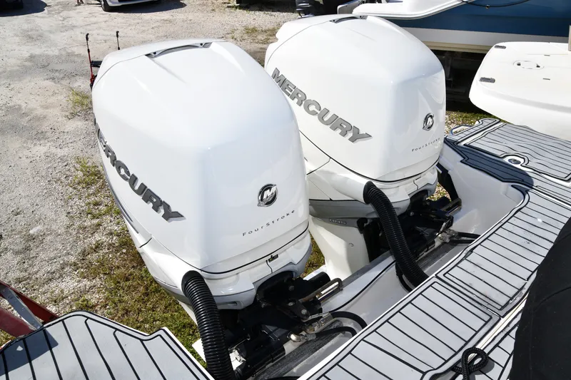 Slide: The Image of Twin Mercury outboard engines on a 2017 Sea Ray SLX 310 boat. - 16