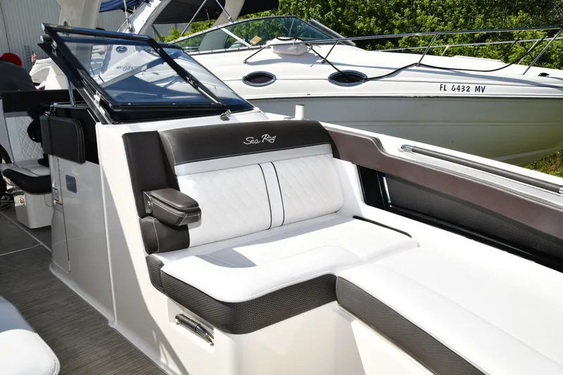 Slide: The Image of 2017 Sea Ray SLX 310 boat interior with luxurious seating and sleek design. - 9