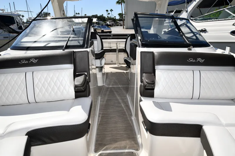 Slide: The Image of 2017 Sea Ray SLX 310 boat interior with luxurious white seating and sleek design. - 14