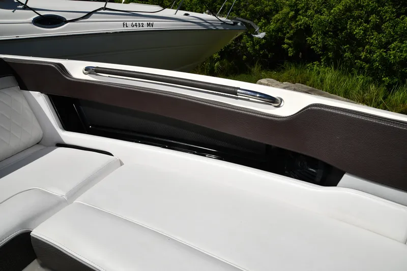 Slide: The Image of 2017 Sea Ray SLX 310 boat interior with white seating and sleek design. - 24