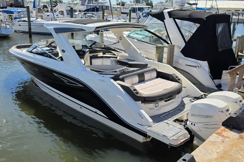 The Image of 2017 Sea Ray SLX 310 boat docked at marina with Mercury engines. - 3
