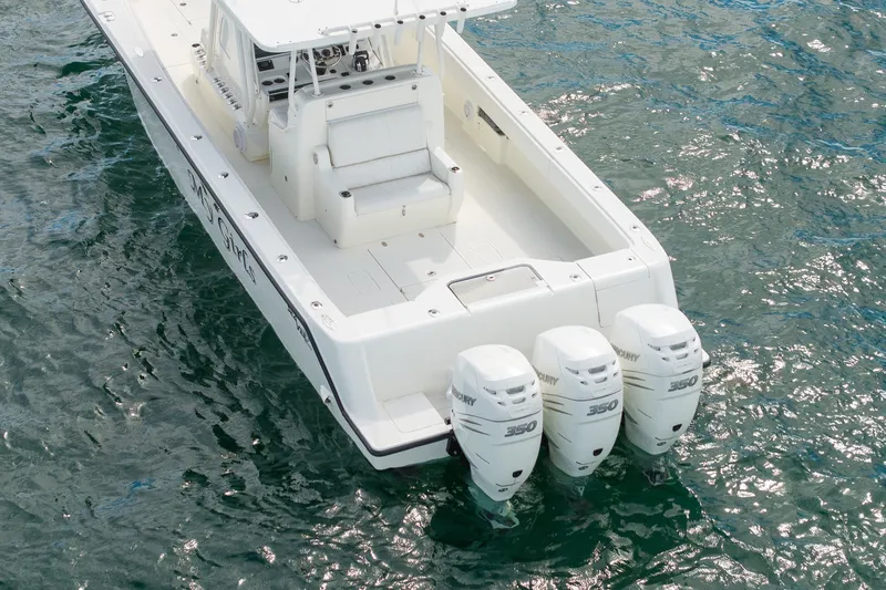 Slide: The Image of 2017 SeaVee 390Z boat with triple Mercury 350 engines on water. - 10