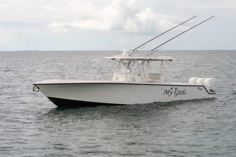 Slide: The Image of 2017 SeaVee 390Z boat named "My Girls" on calm ocean waters. - 4