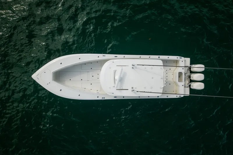 Slide: The Image of Aerial view of 2017 SeaVee 390Z boat on water with triple outboard engines. - 16