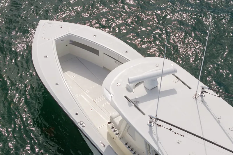 Slide: The Image of 2017 SeaVee 390Z boat on water, showcasing sleek deck design and fishing features. - 8