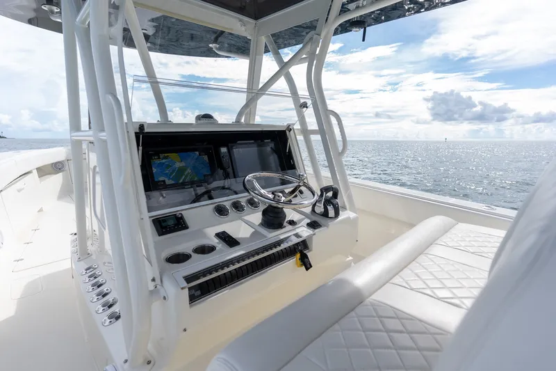 Slide: The Image of 2017 SeaVee 390Z boat cockpit with navigation screens and ocean view. - 28