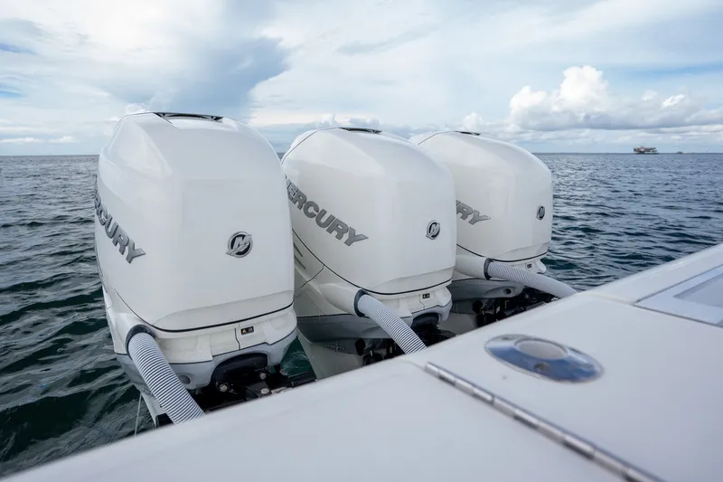 Slide: The Image of Triple Mercury outboard engines on a 2017 SeaVee 390Z boat in open water. - 40