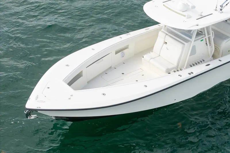 Slide: The Image of 2017 SeaVee 390Z boat on water, showcasing sleek design and spacious deck. - 11
