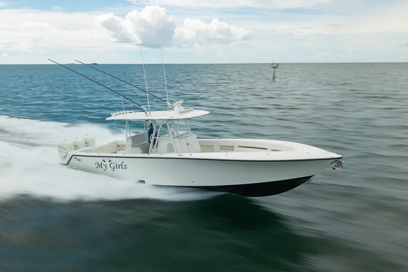Slide: The Image of 2017 SeaVee 390Z boat speeding on open water under a cloudy sky. - 15