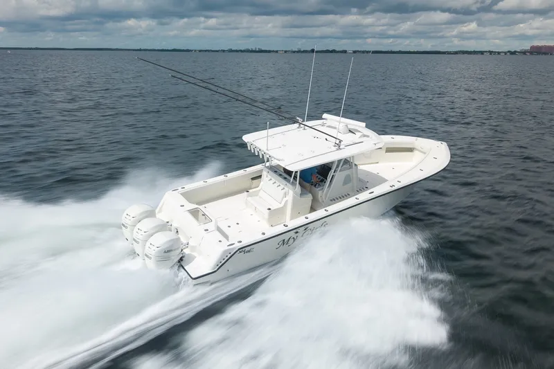 Slide: The Image of 2017 SeaVee 390Z boat speeding on open water under cloudy skies. - 3