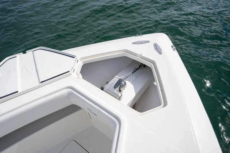 Slide: The Image of 2017 SeaVee 390Z boat anchor compartment, open on calm water. - 27