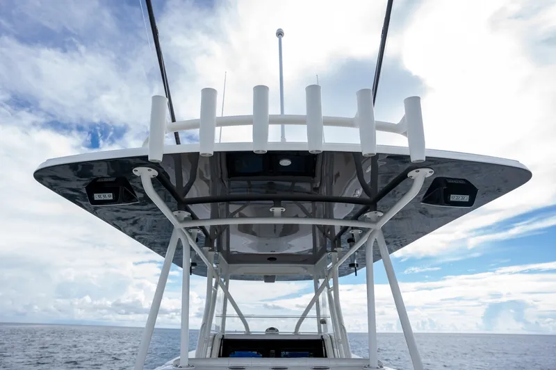 Slide: The Image of 2017 SeaVee 390Z boat with T-top against a cloudy sky backdrop. - 46