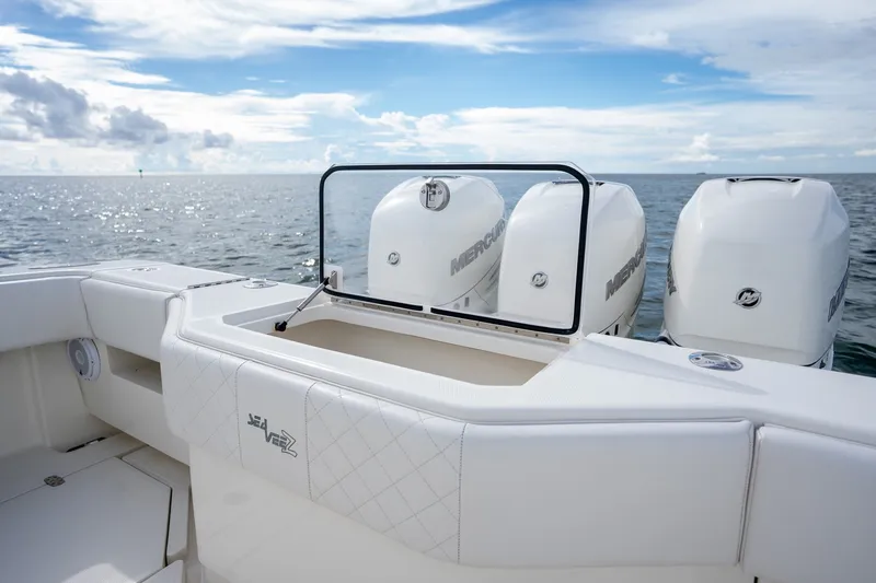 Slide: The Image of 2017 SeaVee 390Z boat with triple Mercury engines on open water. - 34