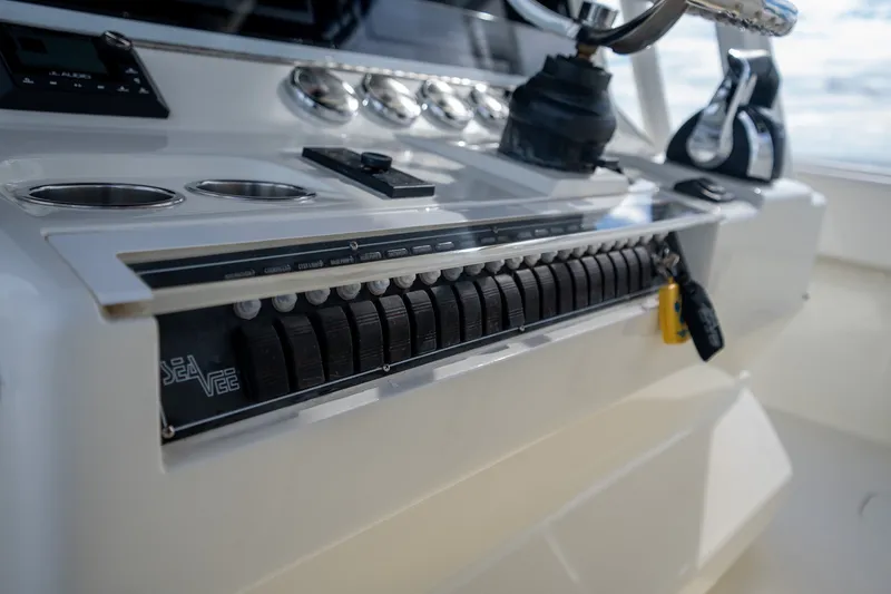 Slide: The Image of 2017 SeaVee 390Z boat dashboard with controls and steering wheel. - 30
