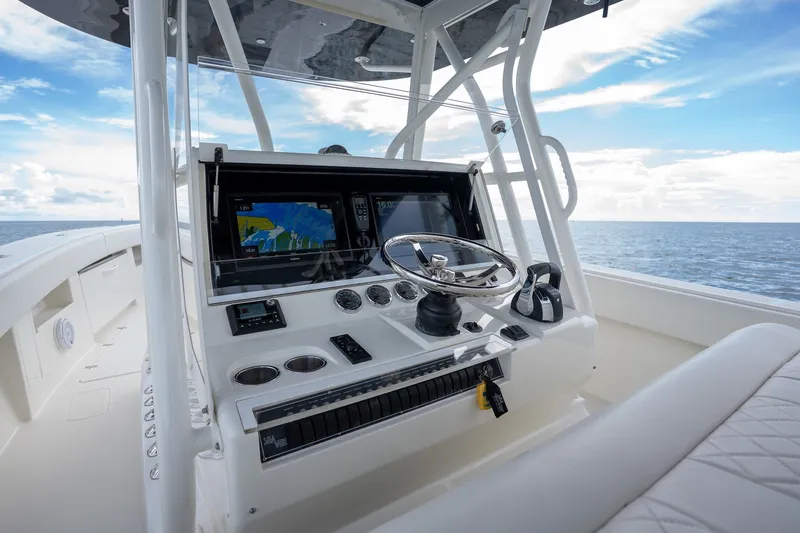 Slide: The Image of 2017 SeaVee 390Z boat helm with navigation screens and ocean view. - 44