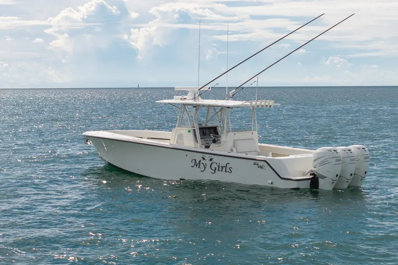 Slide: The Image of 2017 SeaVee 390Z boat named "My Girls" on calm ocean waters. - 6