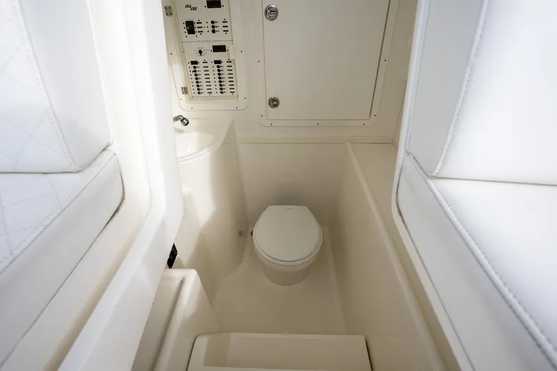 Slide: The Image of 2017 SeaVee 390Z boat interior with toilet and control panel. - 19