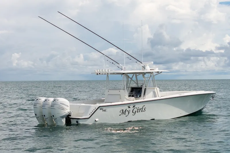 Slide: The Image of 2017 SeaVee 390Z boat on open water under cloudy sky. - 9