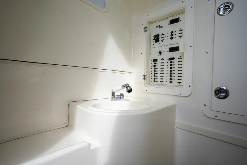 Slide: The Image of 2017 SeaVee 390Z interior with control panel and sink. - 20