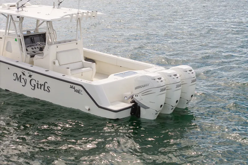 Slide: The Image of 2017 SeaVee 390Z boat with triple Mercury 350 engines on water. - 7