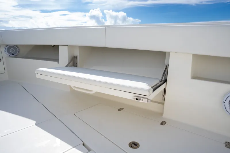 Slide: The Image of 2017 SeaVee 390Z boat interior with foldable seat and storage compartment. - 25