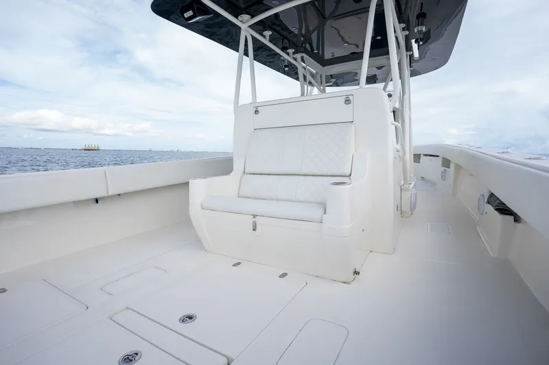 Slide: The Image of 2017 SeaVee 390Z boat interior with white seating and ocean view. - 39