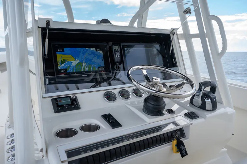 Slide: The Image of 2017 SeaVee 390Z boat dashboard with navigation screens and steering wheel. - 45
