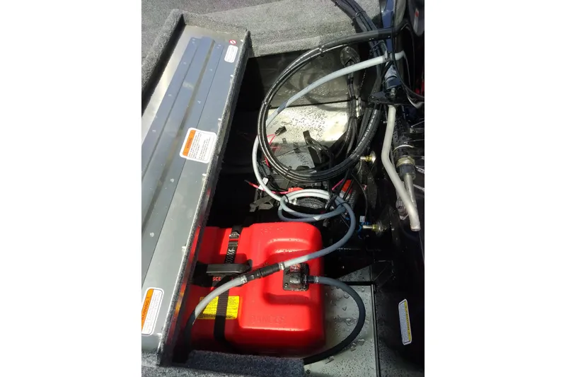 Slide: The Image of 2027 Tracker Super Guide V-16 SC boat interior showing fuel tank and wiring. - 15