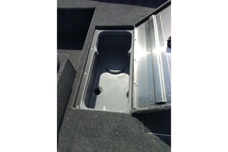 Slide: The Image of Open storage compartment in 2027 Tracker Super Guide V-16 SC boat. - 13