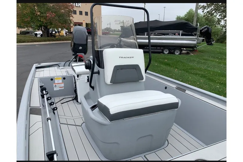 The Image of The image shows a 2027 Tracker Bass Tracker Classic CC boat with a central console and white seating. - 0