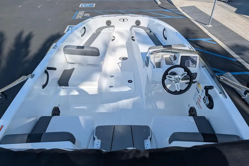 Slide: The Image of Interior view of a 2027 Tahoe T18 boat, showcasing seating and steering console. - 12