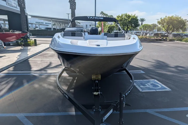 Slide: The Image of 2027 Tahoe T18 boat on trailer in parking lot, front view. - 4