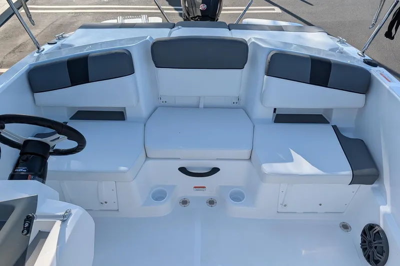 Slide: The Image of Interior seating of 2027 Tahoe T18 boat with modern design and steering wheel. - 10