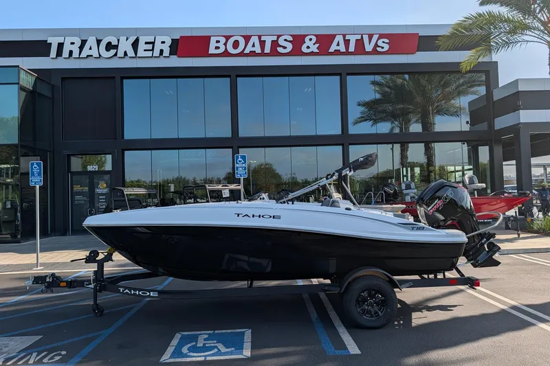 Slide: The Image of 2027 Tahoe T18 boat displayed at Tracker Boats & ATVs dealership. - 7