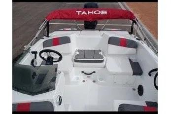 Slide: The Image of 2027 Tahoe T16 boat interior with red canopy and seating arrangement. - 7