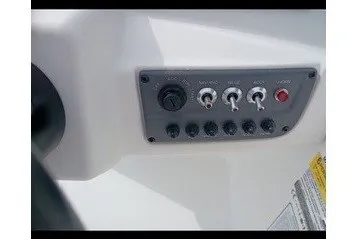 Slide: The Image of Close-up of a control panel with various switches and knobs on a boat. - 10