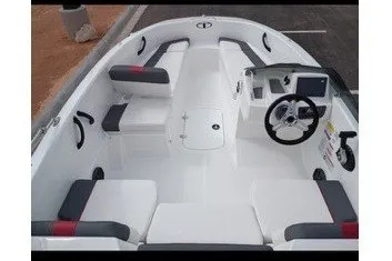 Slide: The Image of The image shows the cockpit of a Tahoe T16 boat with white and gray seating. - 9