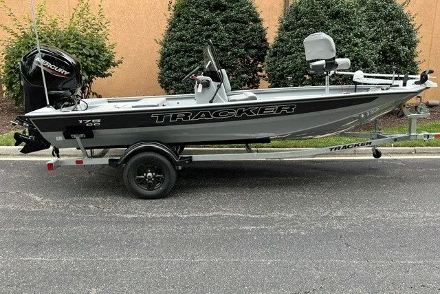The Image of 2027 Tracker Bass Tracker 175 CC boat on trailer, parked outdoors. - 0