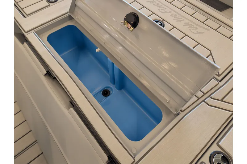 Slide: The Image of Open storage compartment on 2027 Tracker Bass Tracker 175 CC boat, featuring blue interior. - 13