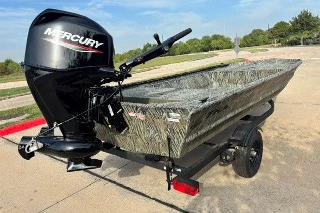 The Image of 2027 Tracker Grizzly 1648 Utility boat with Mercury outboard motor on a trailer. - 0