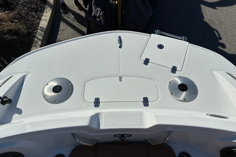 Slide: The Image of 2027 Tahoe 1950 boat deck with storage compartments and metal fixtures. - 11