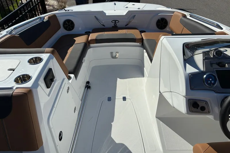 Slide: The Image of Interior of a 2027 Tahoe 1950 boat featuring seating and control panel. - 9
