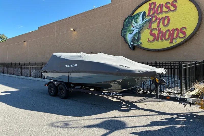 Slide: The Image of Covered 2027 Tahoe 1950 boat on trailer outside Bass Pro Shops. - 13