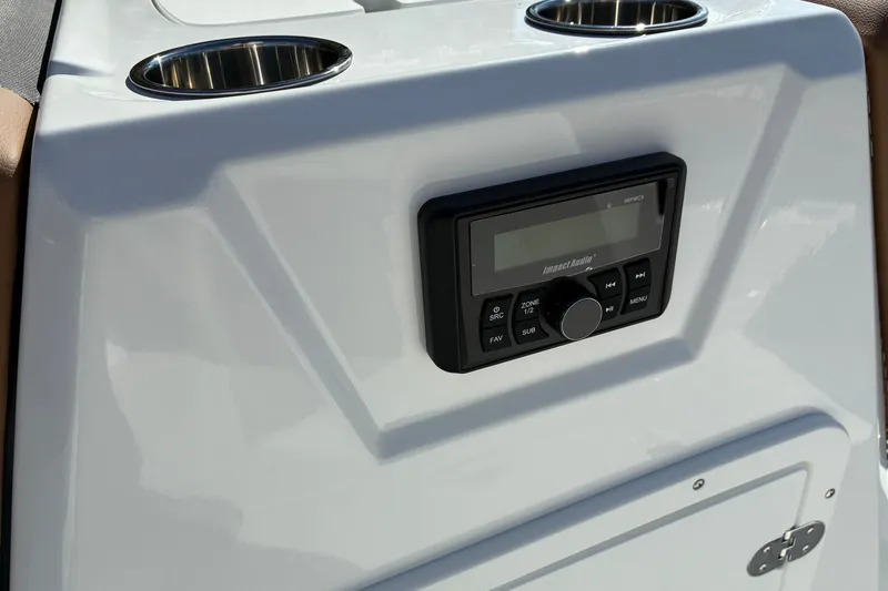 Slide: The Image of Control panel of 2027 Tahoe 1950 boat with audio system and cup holders. - 10