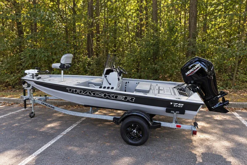 The Image of 2027 Tracker Bass Tracker 175 CC boat on trailer in wooded area. - 0