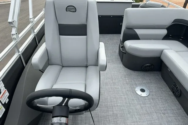 Slide: The Image of 2027 Sun Tracker SportFish 22 DLX boat interior with gray seating and steering wheel. - 20