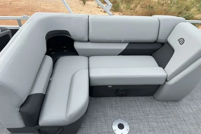 Slide: The Image of 2027 Sun Tracker SportFish 22 DLX boat interior with gray cushioned seating. - 18